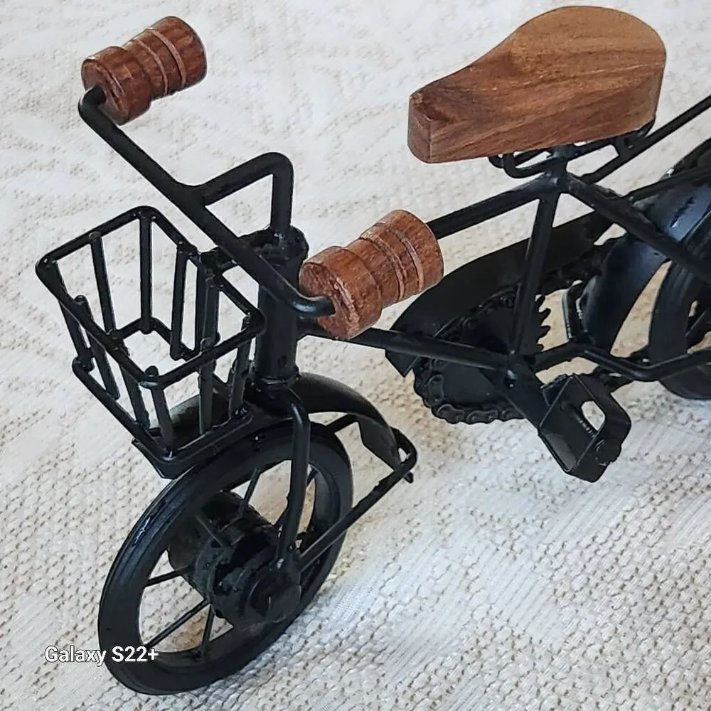 Cute black metal and wood standing bicycle decor with movable pedals and chain